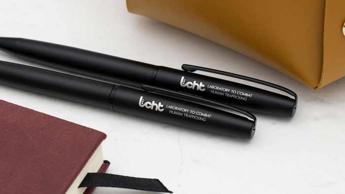 Two Dayspring pens with LCHT's logo as example to take action locally